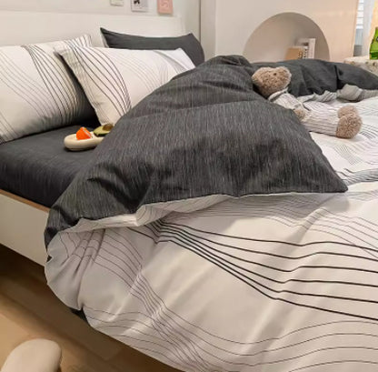 Juego de cama de cuatro piezas de algodón puro con degradado de color simple