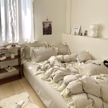 Juego de cuatro piezas para el hogar de seersucker plisado en color crema