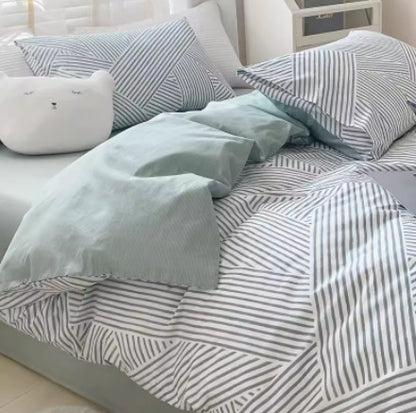 Juego de cama de cuatro piezas de algodón puro con degradado de color simple